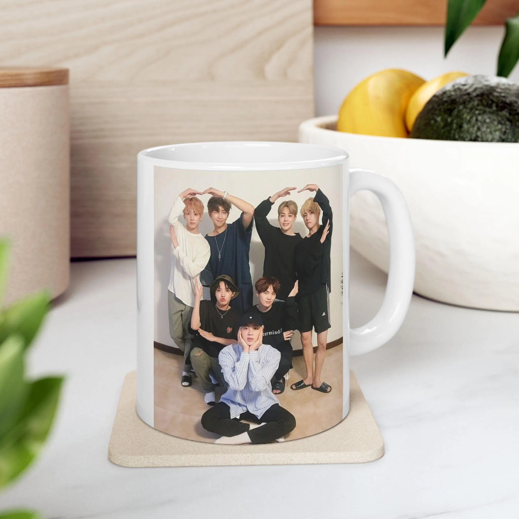Large ceramic beverage mug with music group theme design