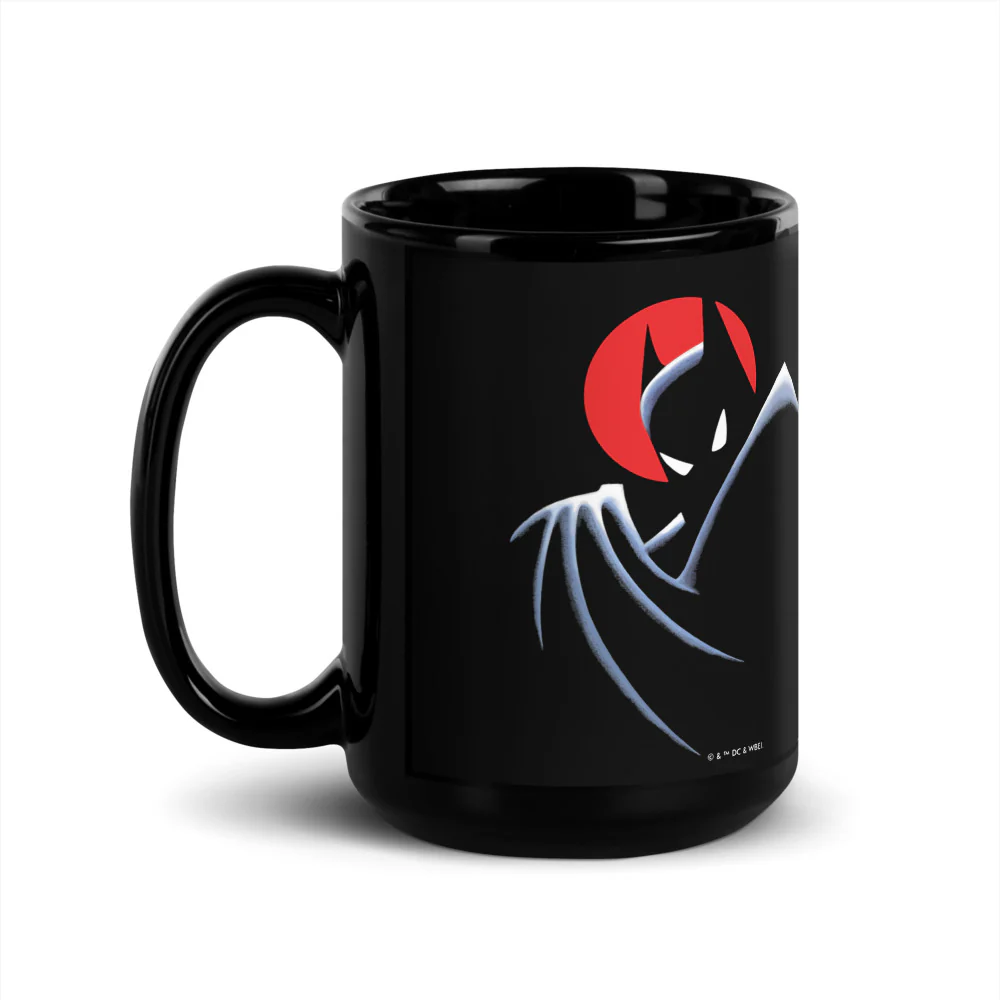 Glossy black ceramic mug featuring Batman The Animated Series silhouette graphic and red moon background