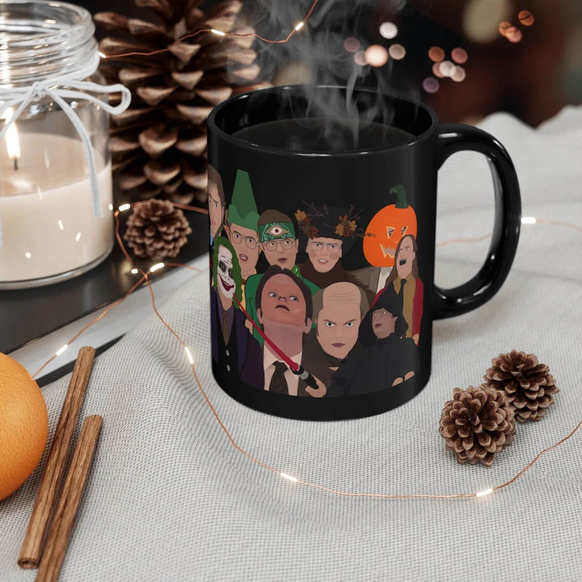 Black ceramic coffee mug featuring cartoon illustrations of Dwight Schrute in various costumes from The Office TV show including Joker Elf and Pumpkin head designs