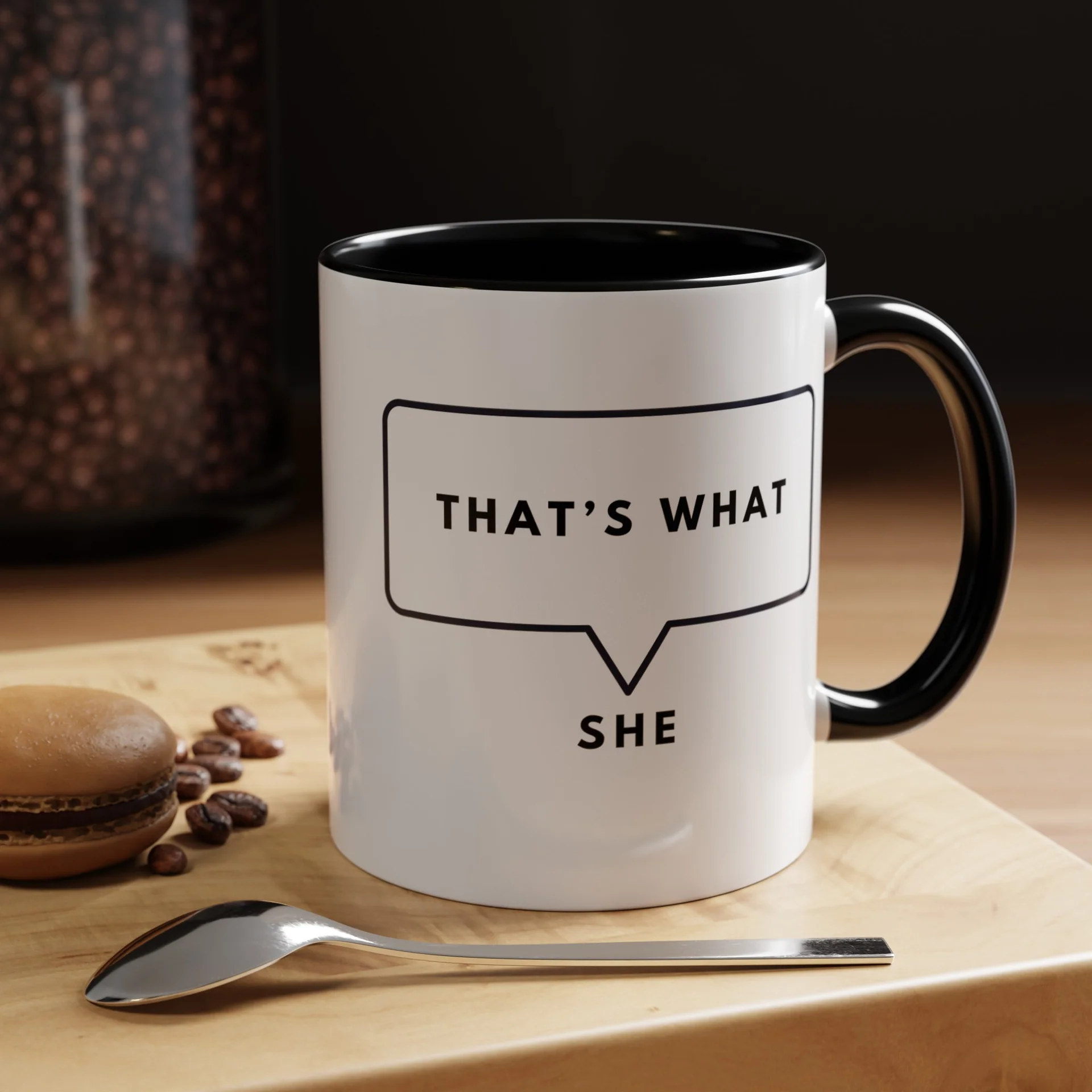 White ceramic mug with black interior and handle featuring That Is What She Said speech bubble design