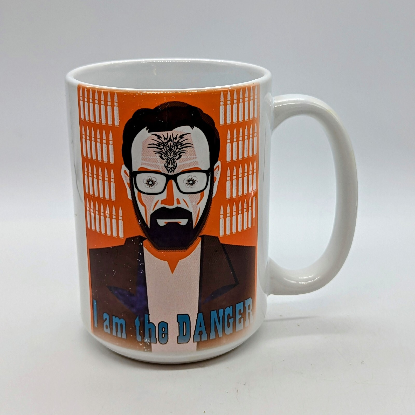 White ceramic mug featuring Breaking Bad Walter White portrait with I Am The Danger text and bullet background