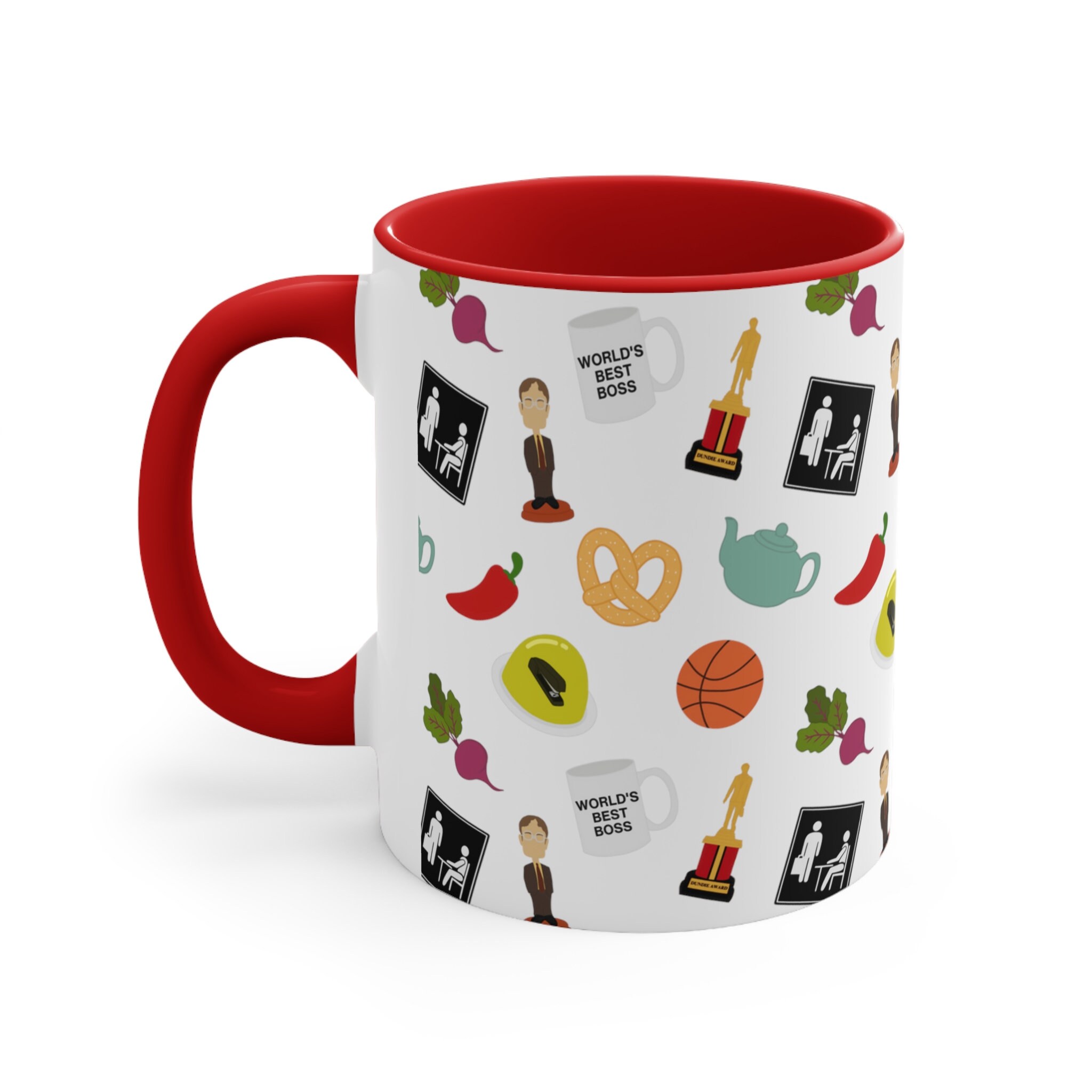 Close up of a character themed ceramic mug with a red handle and interior featuring illustrated icons like iconic trophies and staplers in gelatin.