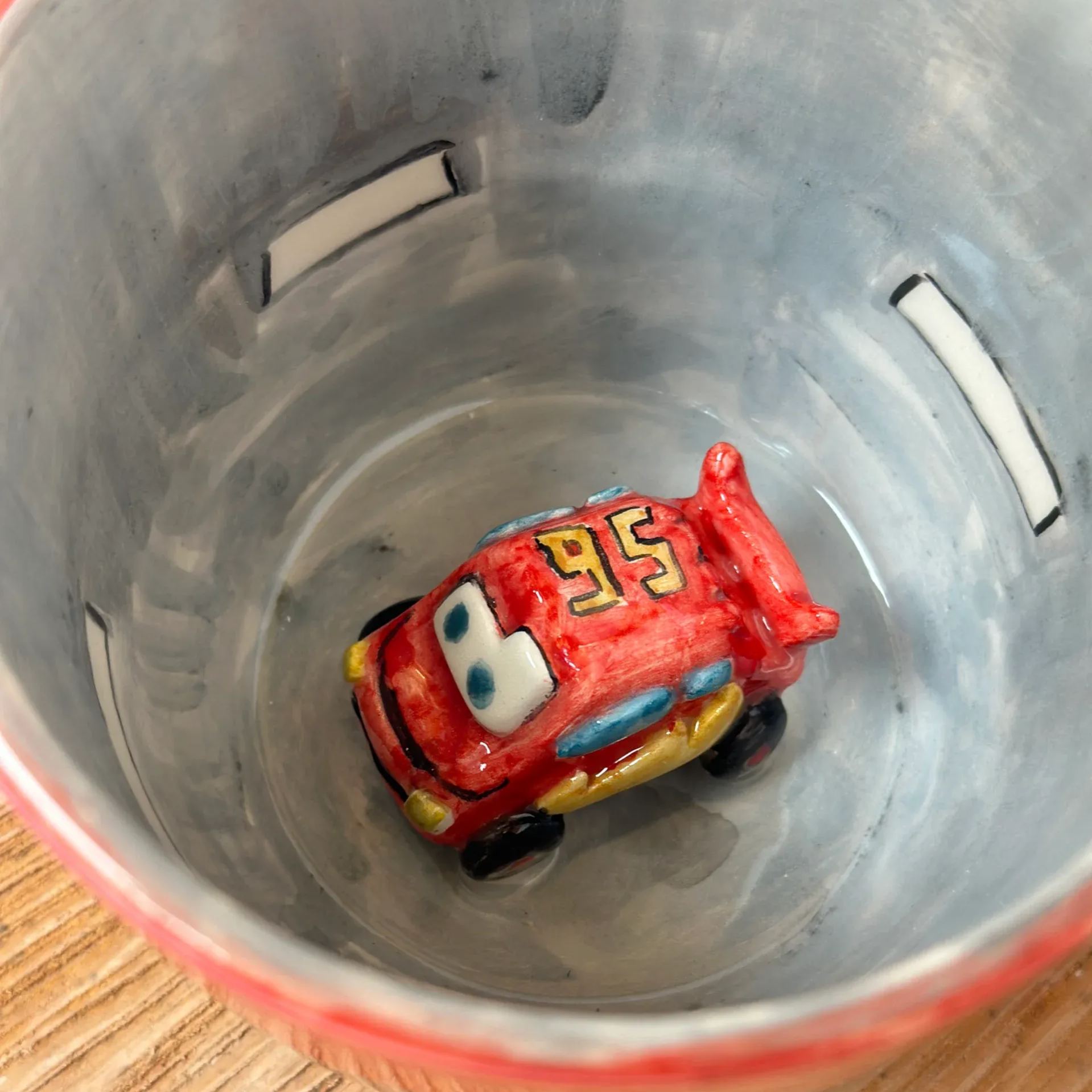 Handmade ceramic coffee mug with unique character design