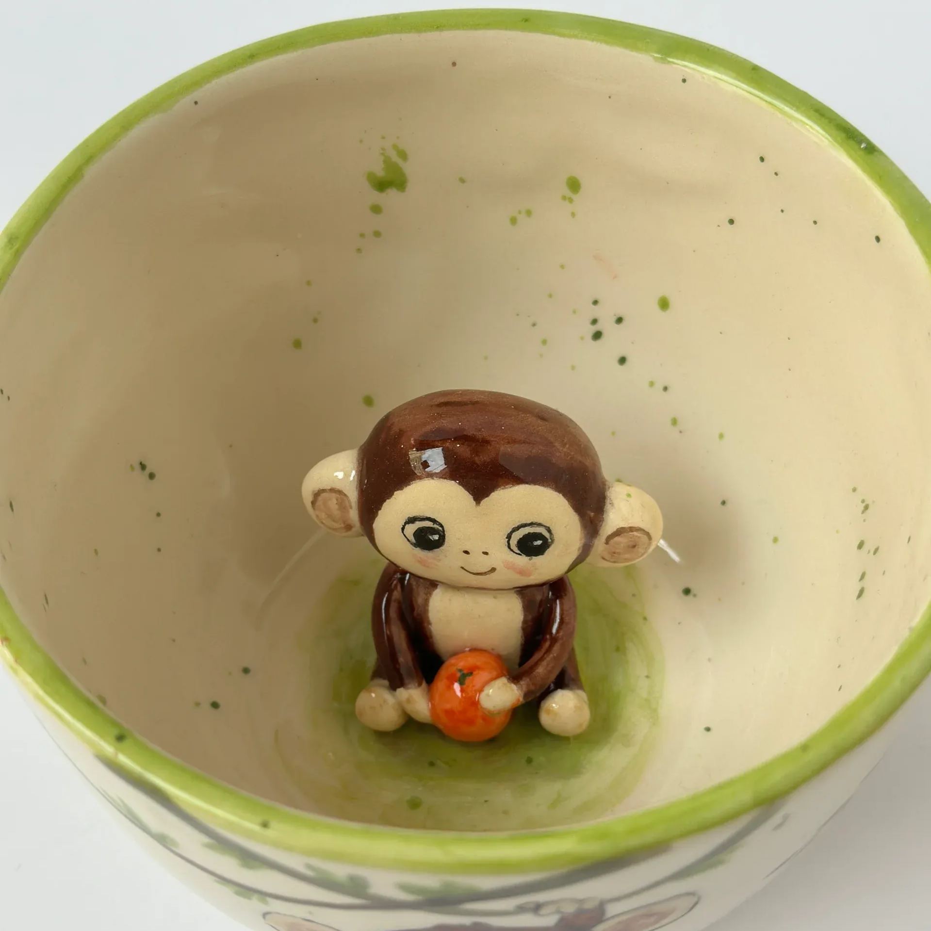 Handmade ceramic coffee mug with animal design