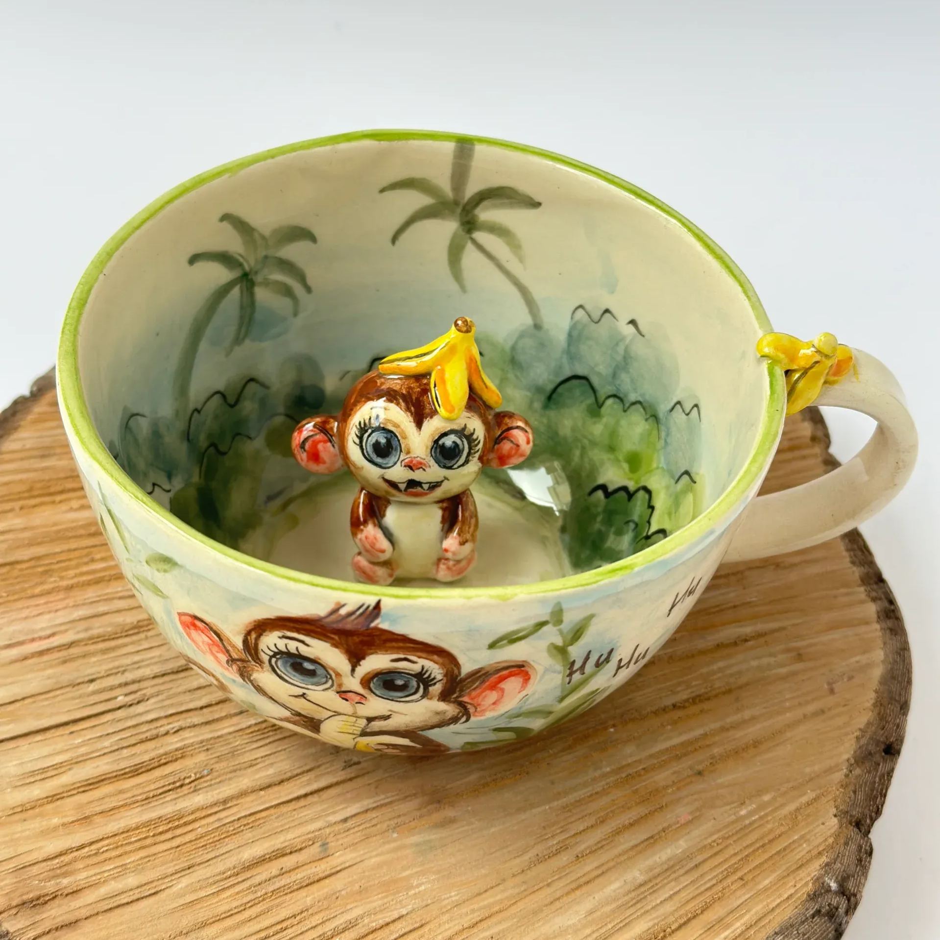 Handmade ceramic coffee mug with monkey design