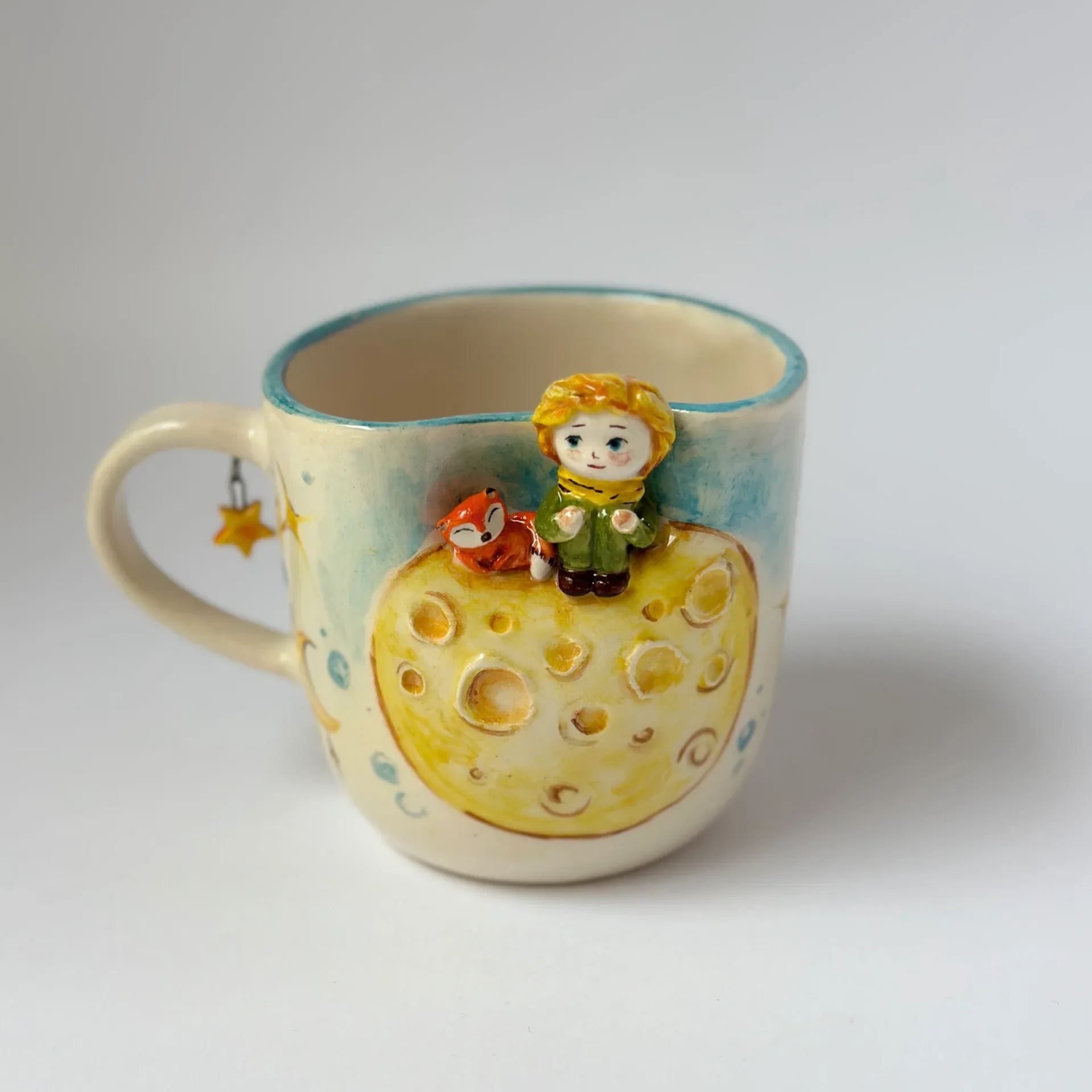 Handmade ceramic coffee mug with prince illustration