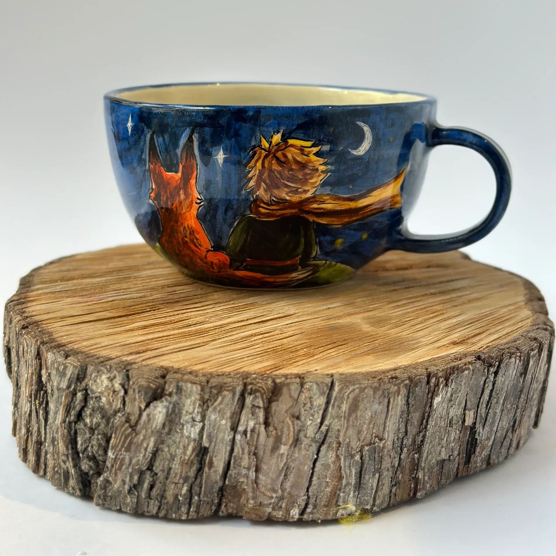 Handmade ceramic coffee cup with character design