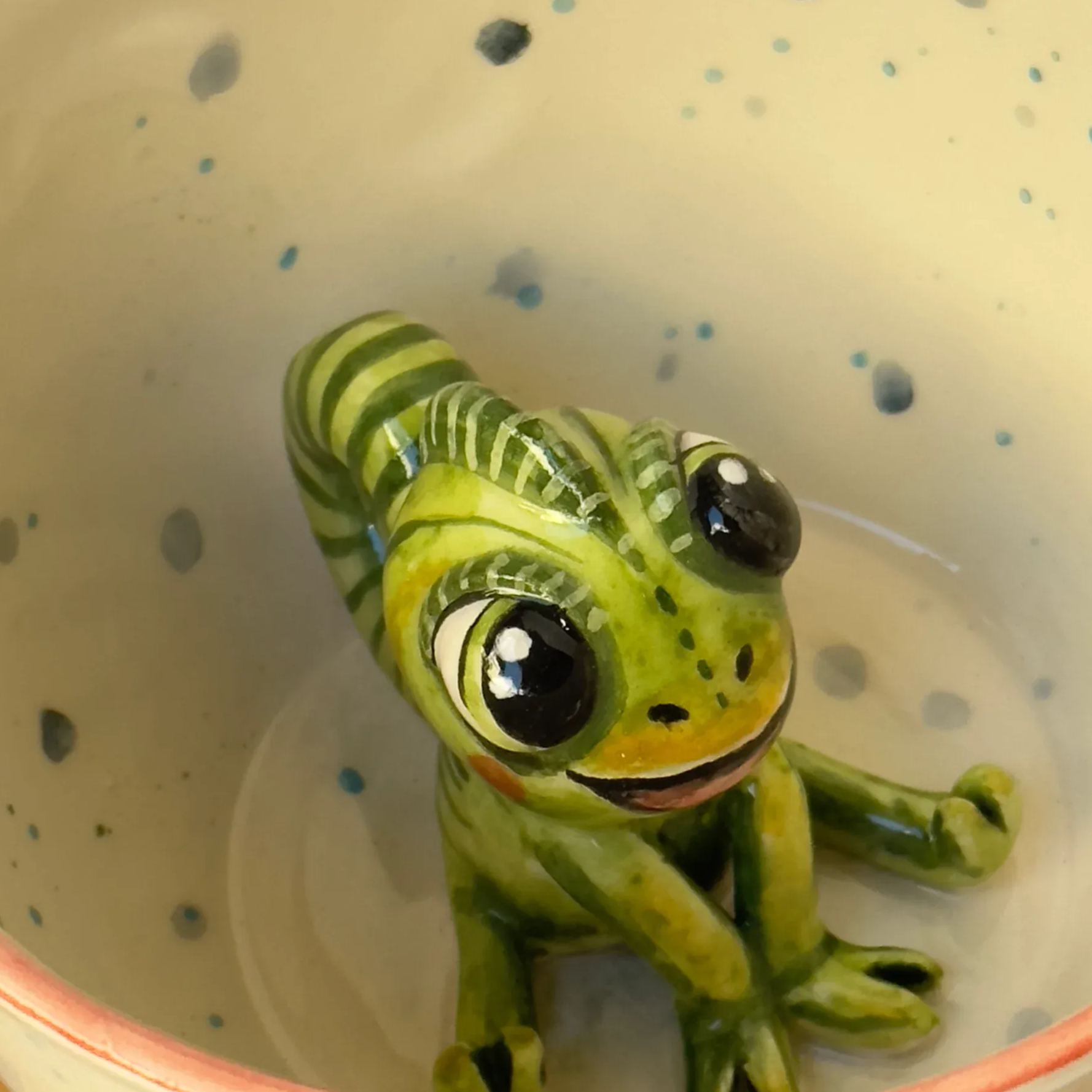 Handmade ceramic coffee mug with glossy glaze finish