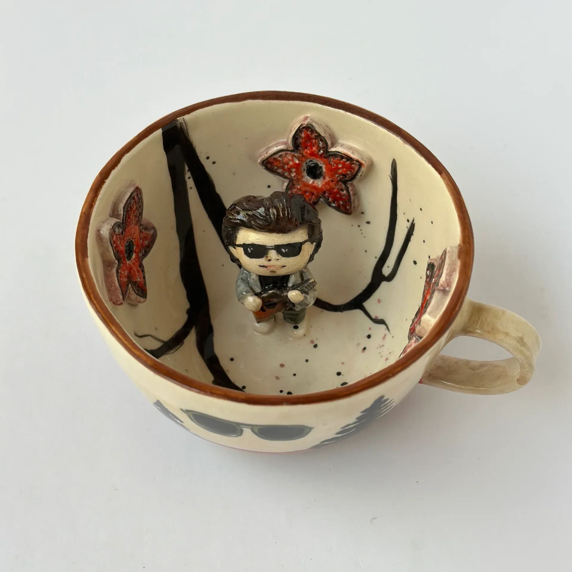 Handmade ceramic coffee mug with glossy glaze finish