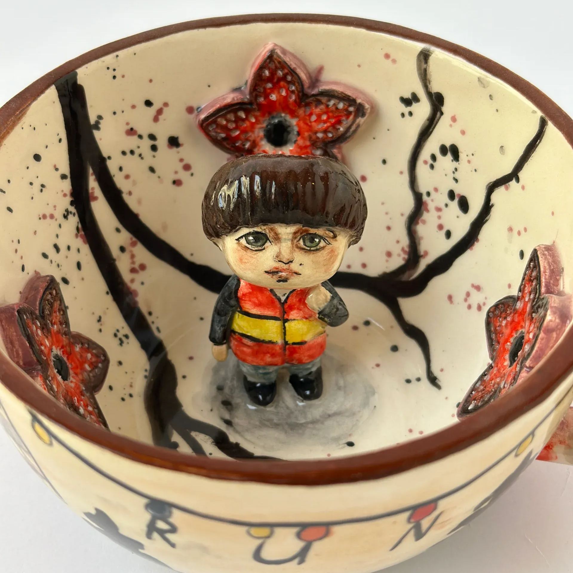 Handmade ceramic coffee mug with television character theme