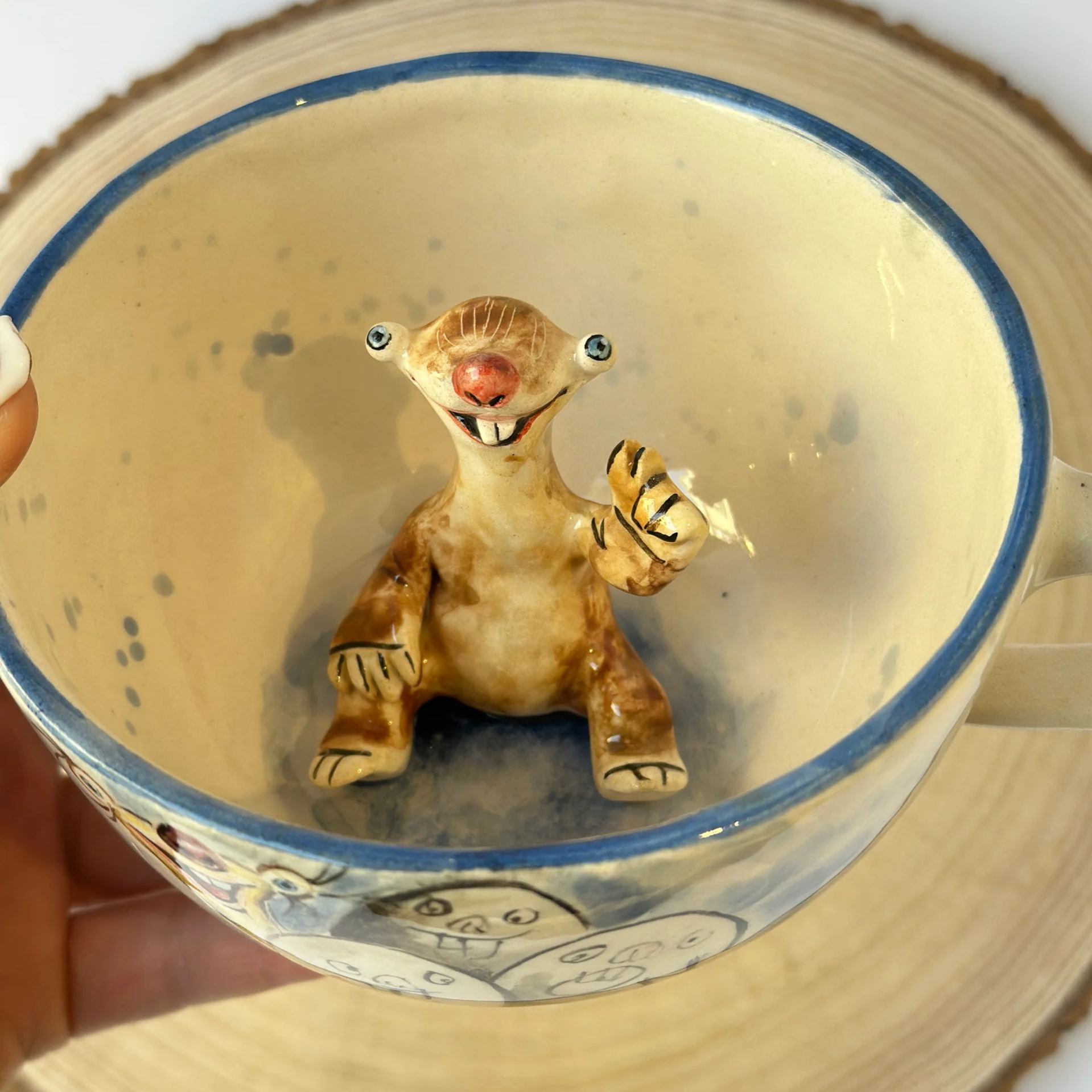 Handmade ceramic coffee mug with character features