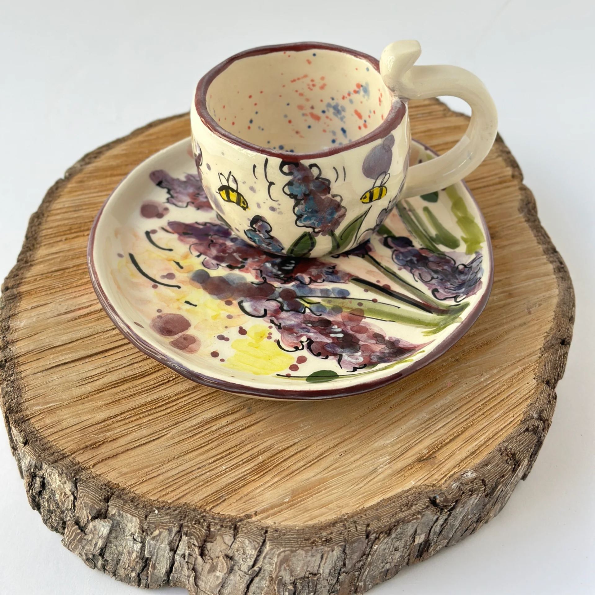 Handmade floral ceramic mug and matching saucer set
