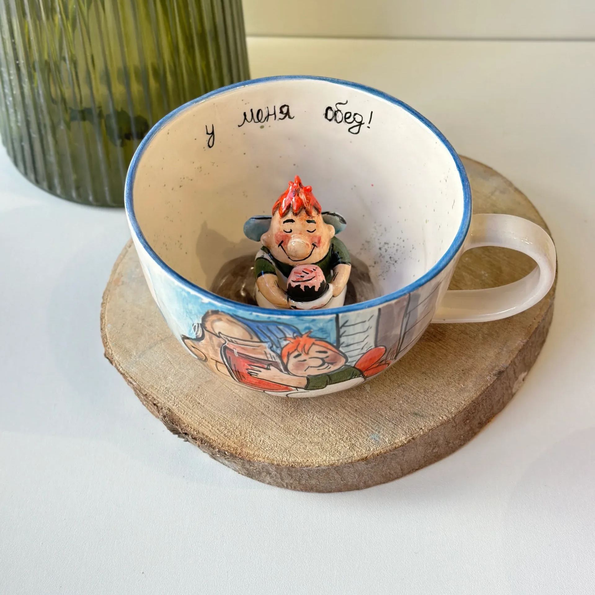 Handmade ceramic coffee mug with cartoon character design