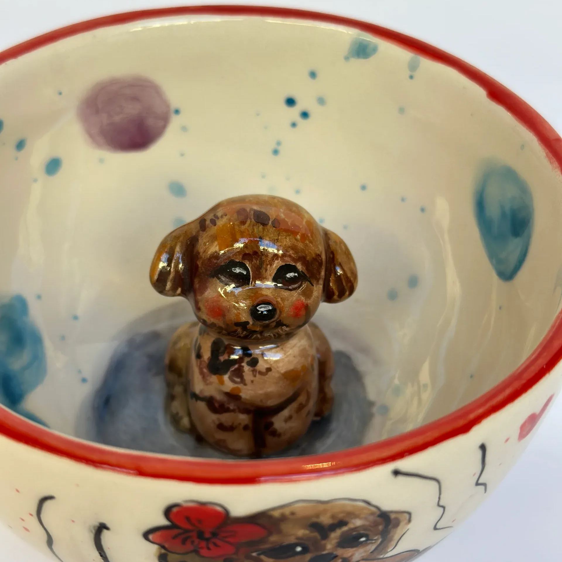 Handmade ceramic coffee mug with animal motif