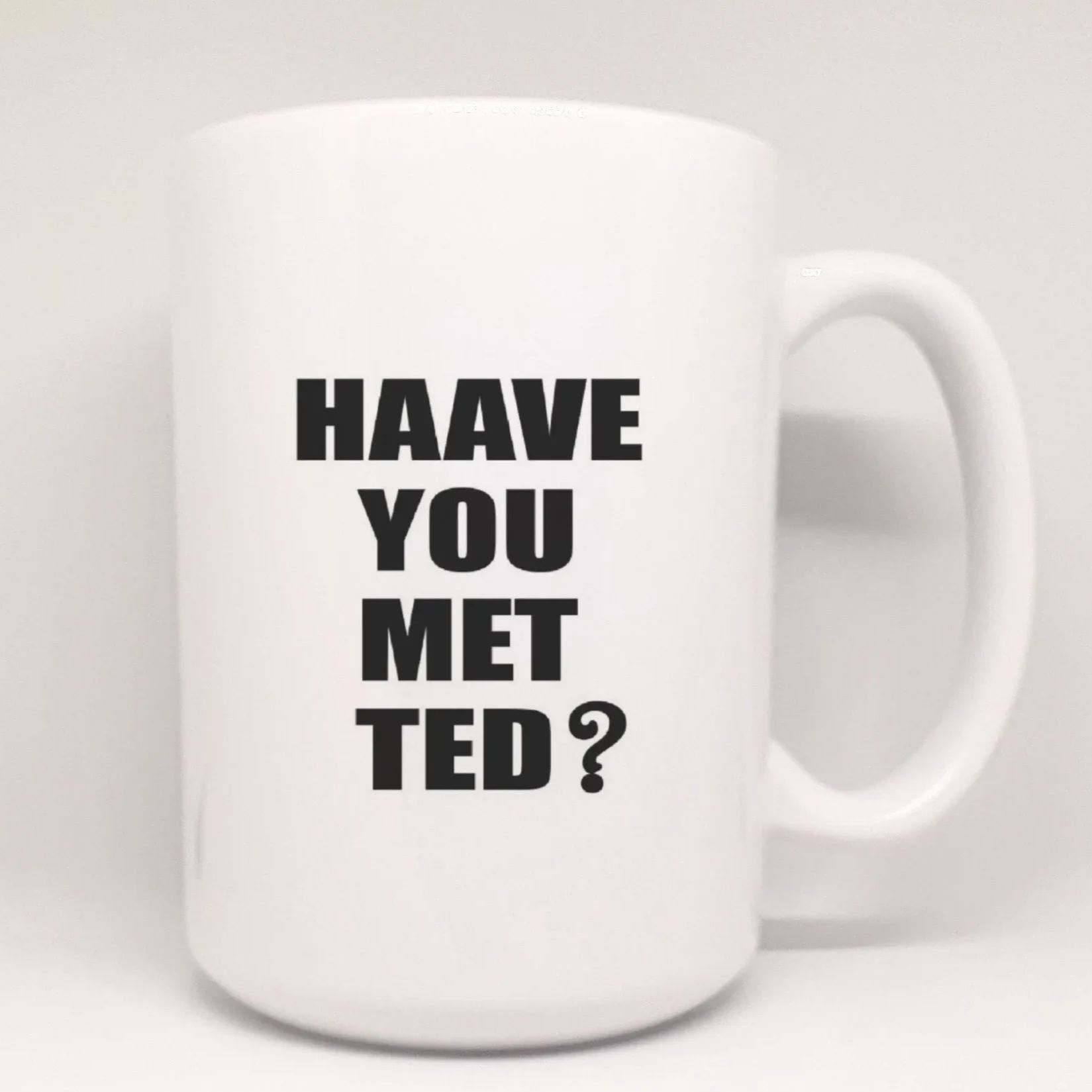 Tall white mug featuring Haave You Met Ted quote design in black font
