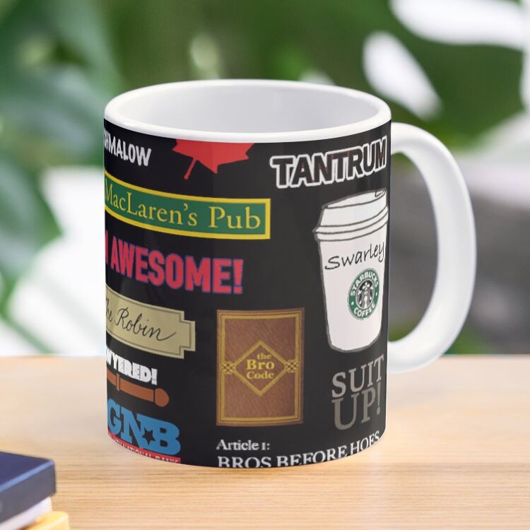 Close up of a ceramic mug with How I Met Your Mother show references like Swarley and MacLarens Pub icons
