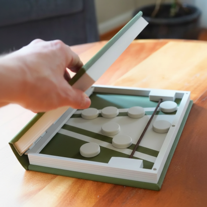 Portable Sling Puck Book Game For Everyone