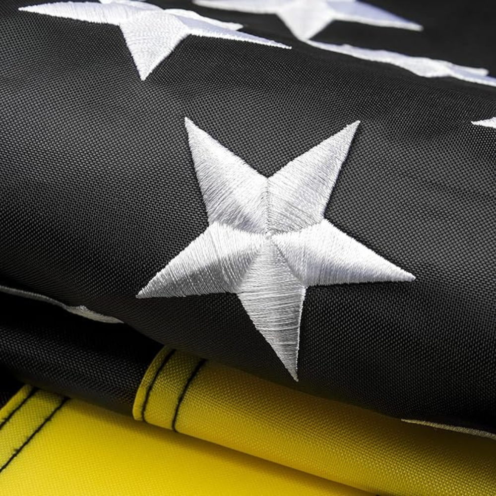 Classic Embroidered Flag With Strong Reinforced Edges displayed indoors on wall mount