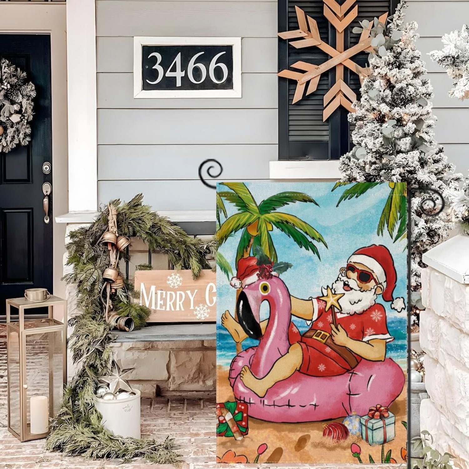 Tropical Santa Printed Christmas Garden Flag displayed outdoors on garden stake