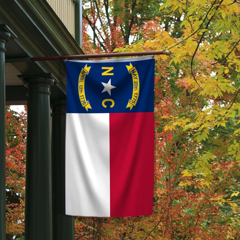 North Carolina Double Sided Embroidered Flag flying on outdoor flagpole