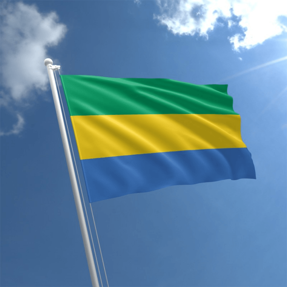 Gabon Country National Flag flying on outdoor flagpole