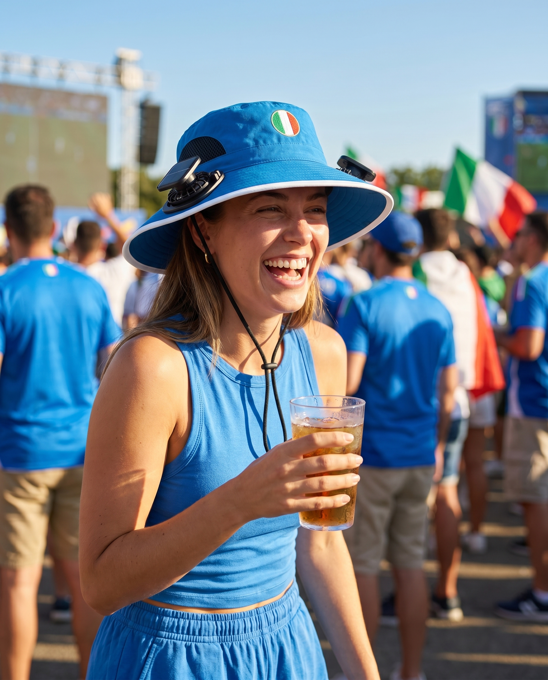 Woman wearing the Italy solar cooling fan hat at a sunny World Cup watch party
