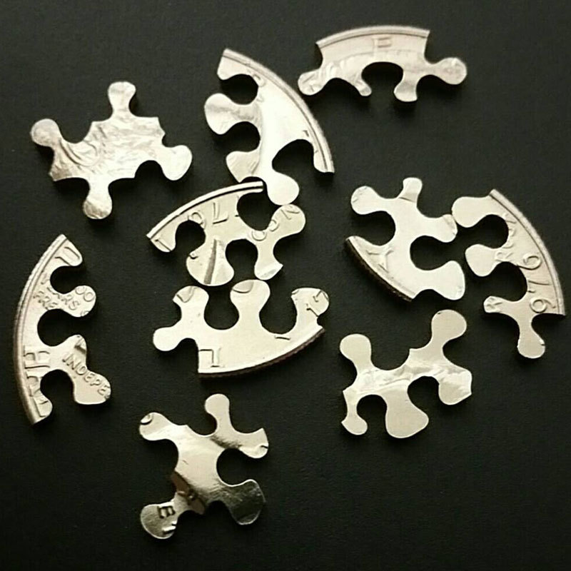 Puzzle cut from a Kennedy half dollar