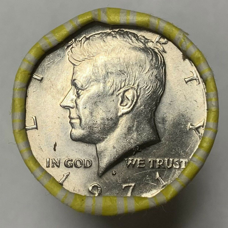 Puzzle cut from a Kennedy half dollar