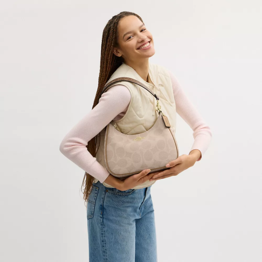 Teri Hobo Bag In Blocked Signature Canvas