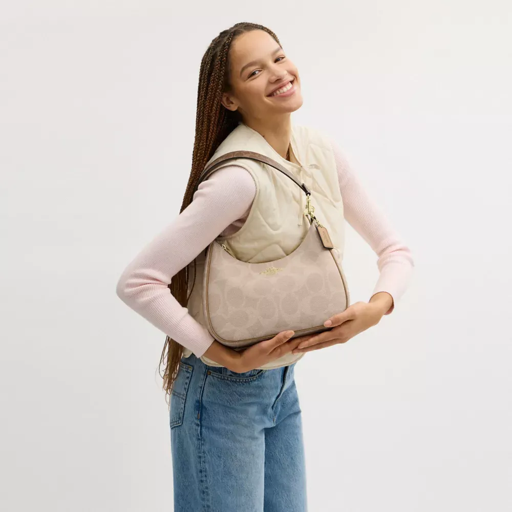 Teri Hobo Bag In Blocked Signature Canvas