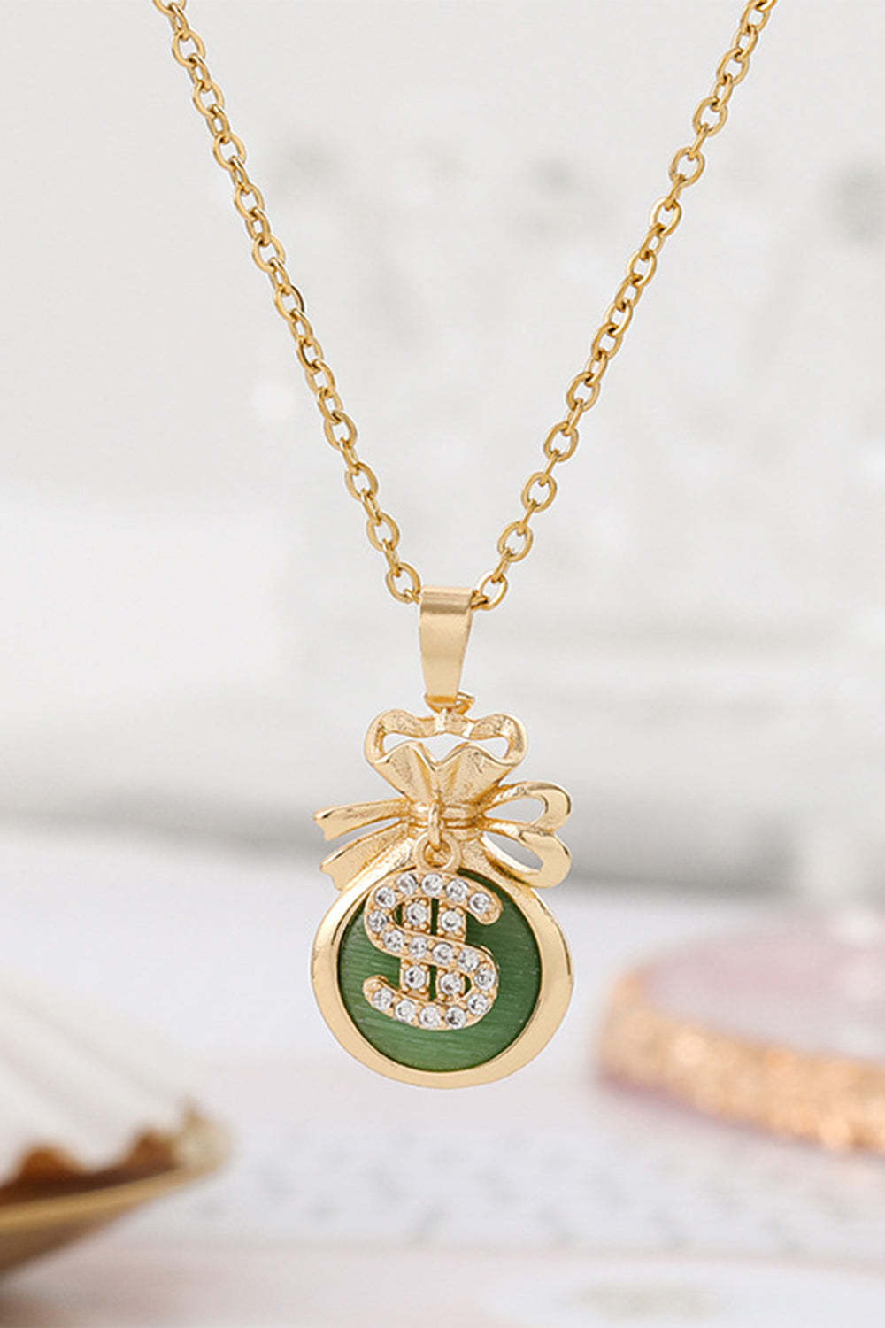 Necklace Featuring a Golden Money Bag