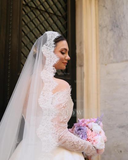 Elegant Ivory Strapless Long-Sleeve Ball Gown Wedding Dress with Chapel Train