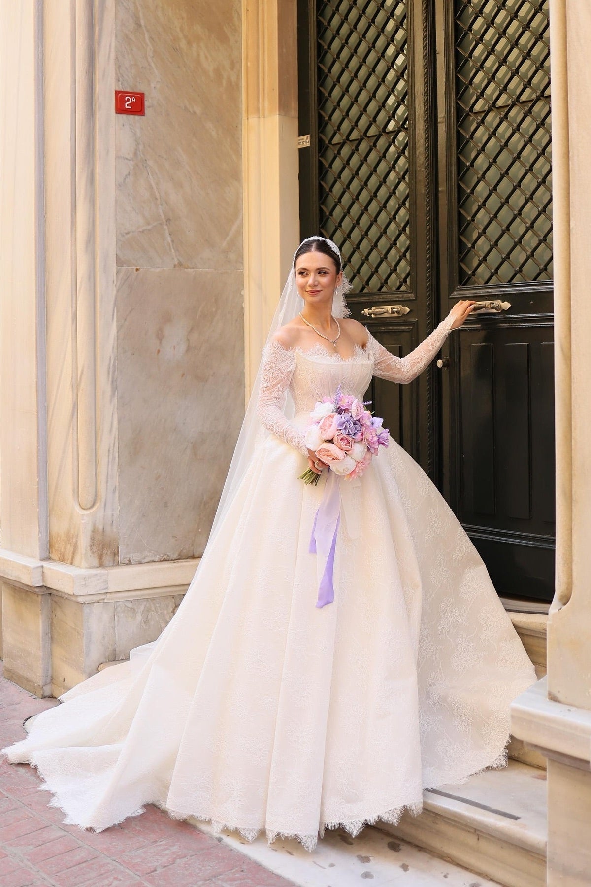 Elegant Ivory Strapless Long-Sleeve Ball Gown Wedding Dress with Chapel Train