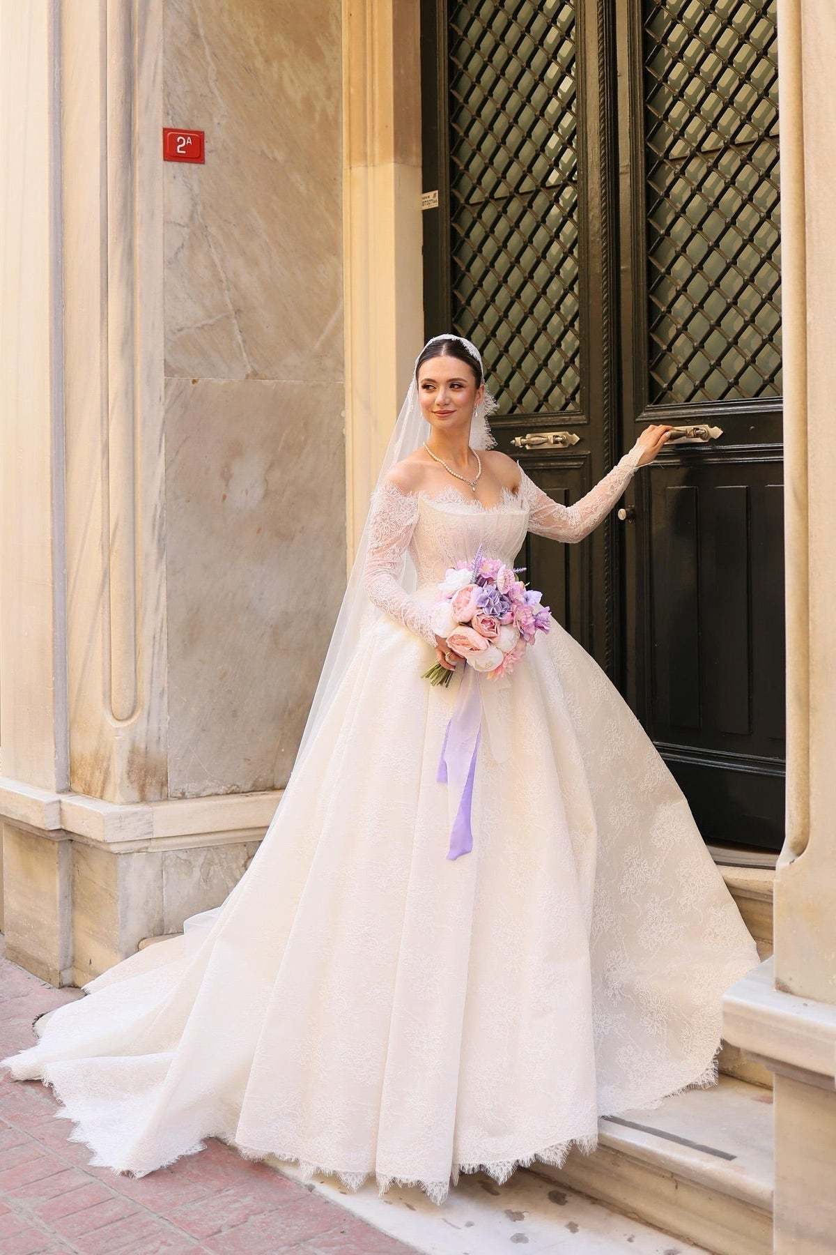 Elegant Ivory Strapless Long-Sleeve Ball Gown Wedding Dress with Chapel Train