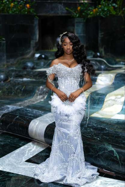 Gorgeous Silver Off-the-Shoulder Sleeveless Mermaid Prom Dress with Tassels and Rhinestones