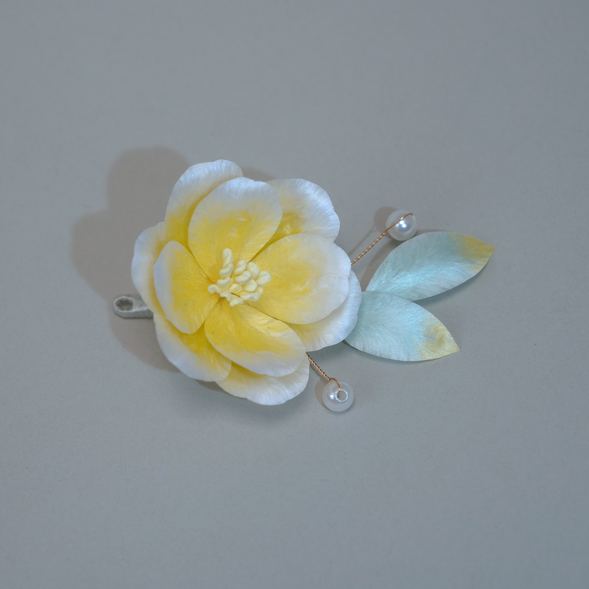 Traditional hand-crafted intangible cultural heritage velvet flower hairpin made of silk.