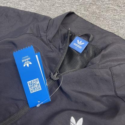 adidas Originals Rekive graphic detail woven track top in green