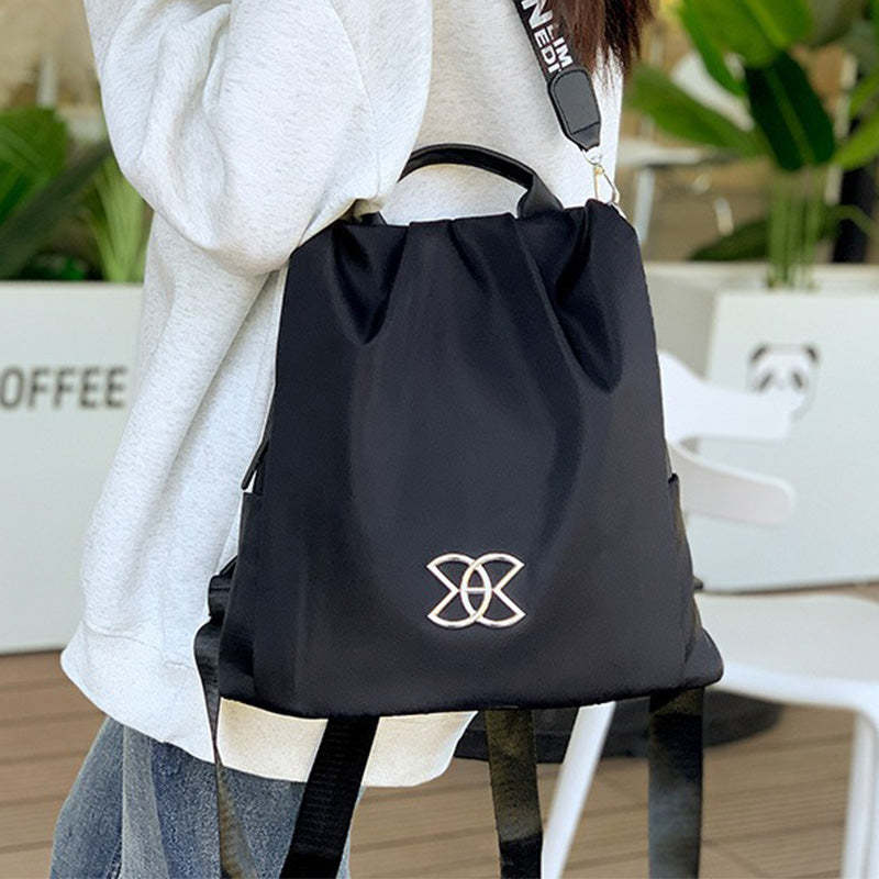 Taška přes rameno s ochranou proti krádeži a diskrétním zapínáním na zadní straně - Lyvazza™