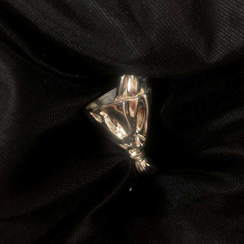 Wearable flower vase brooch on black fabric