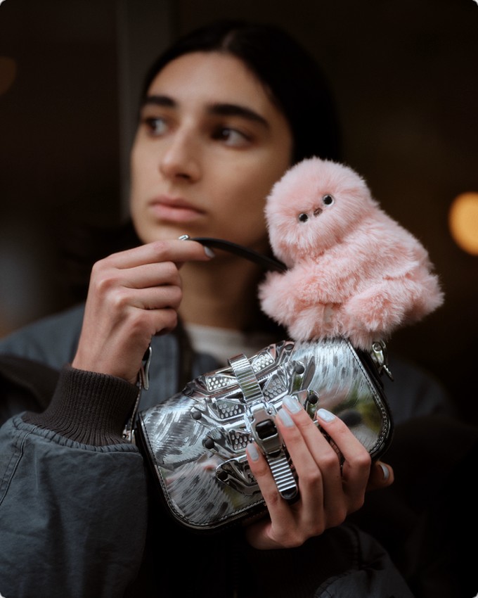 Mirumi: A Charm Robot that Steals a Glance—and Your Heart