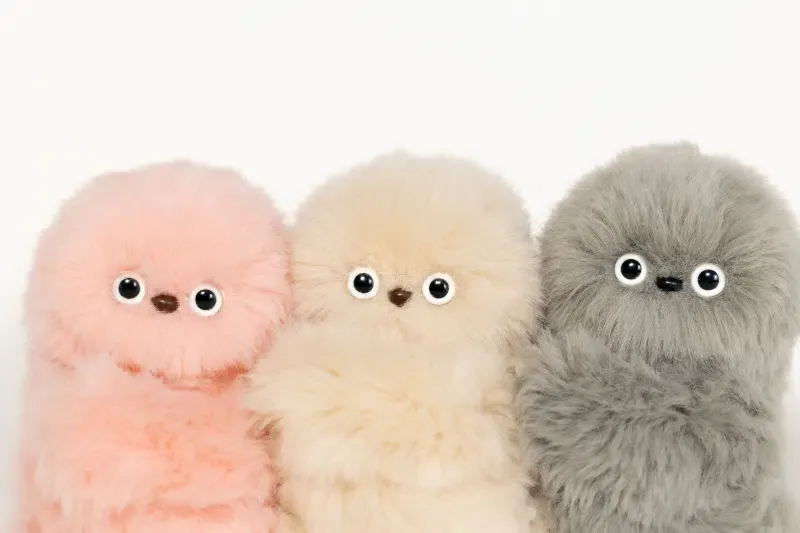 Mirumi: A Charm Robot that Steals a Glance—and Your Heart