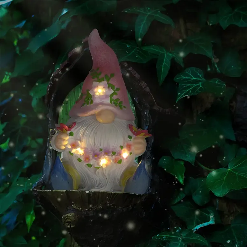 Dwarf sculpture holding a butterfly with Solar LED Lights