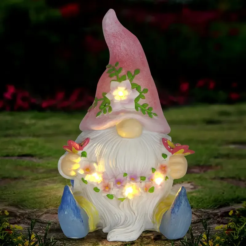Dwarf sculpture holding a butterfly with Solar LED Lights