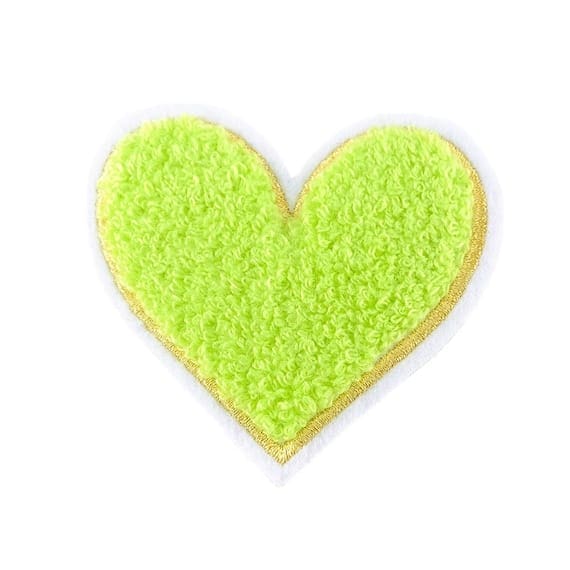 A green heart shaped cookie on a white background.