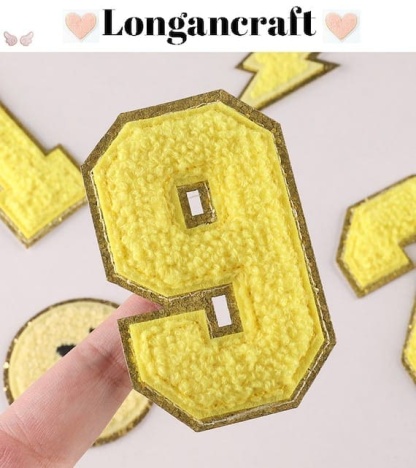 A yellow number chenille patch