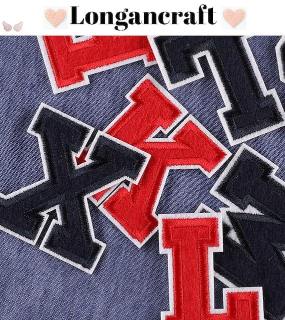 A set of red and blue letter embroidered patches.