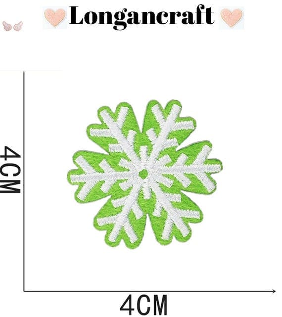 A green and white snowflake embroidered patch.