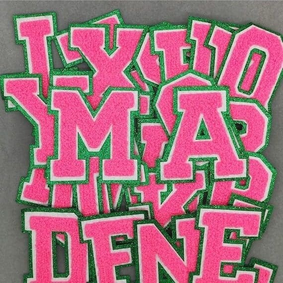 A bunch of Cheeky Pink Chenille Iron On Letters