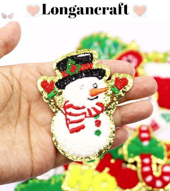 A person is holding Christmas Iron On Patches