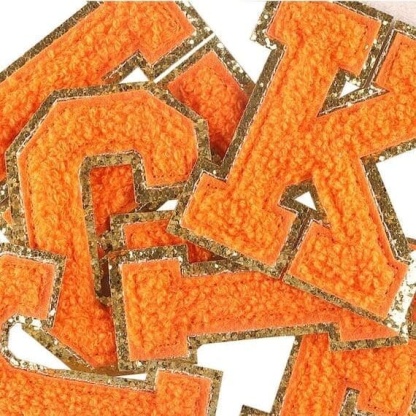 A set of Orange Chenille Iron On Letters